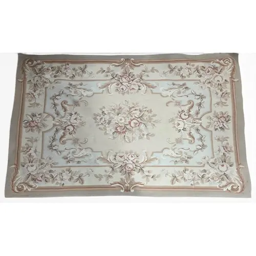 A good Cream ground Aubuson style Rug with floral design. 12...