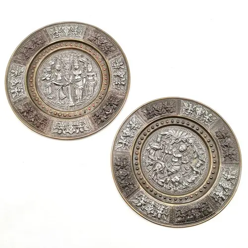 2 x antique Indian silver decorated embossed circular plaque...