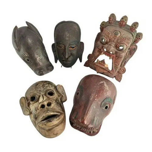 A selection of five vintage 20th century tribal carved wood ...