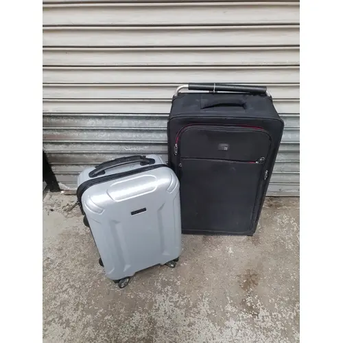 TWO SUITCASES COMPRISING IT LUGGAGE AND PERRY ELLIS Note: al...
