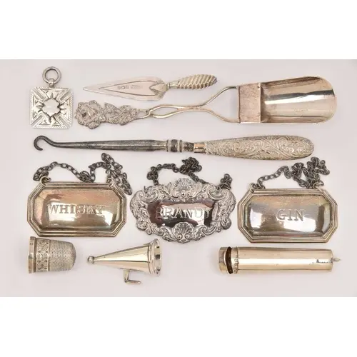 AN ASSORTMENT OF SILVER ITEMS, to include a silver medal, a ...