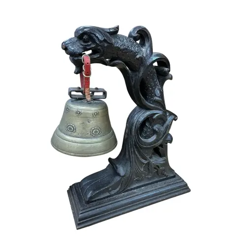 A Chinese carved hardwood and bronze dragon temple bell, hei...