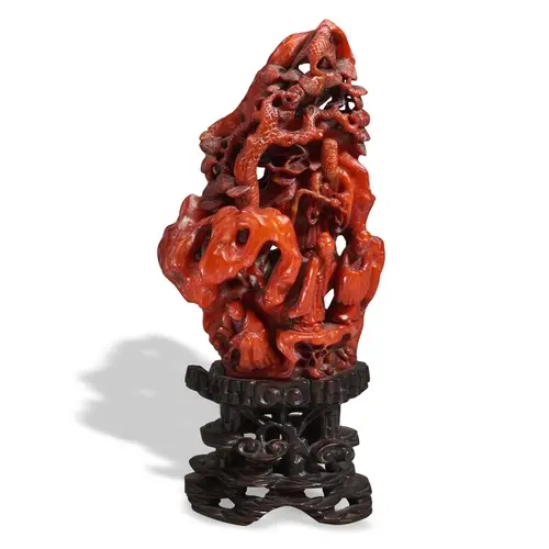 A RARE CARVED AMBER GROUP QING DYNASTY (1644-1911) 琥珀山石人物摆件 ...