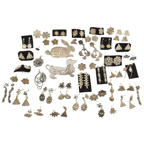 Collection of silver and white metal filigree earrings and b...