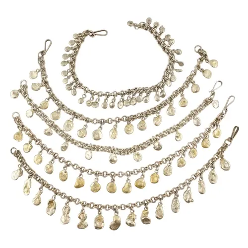 A collection of contemporary silver white metal pebble strun...