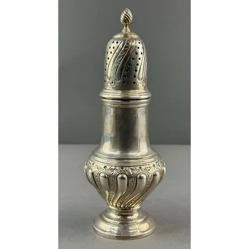 Silver: a baluster sugar caster by Joseph Rodgers & Sons...
