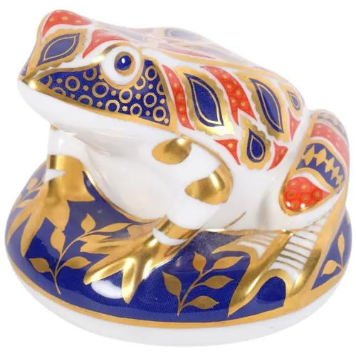 A Royal Crown Derby paperweight, in the form of a frog, silv...