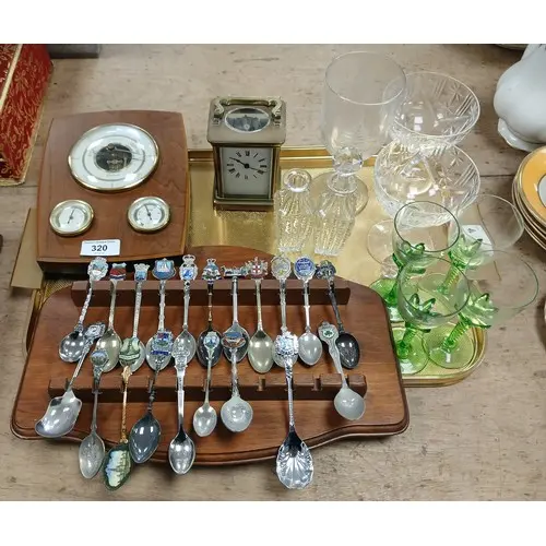 Collection of souvenir spoons on rack, brass carriage clock,...