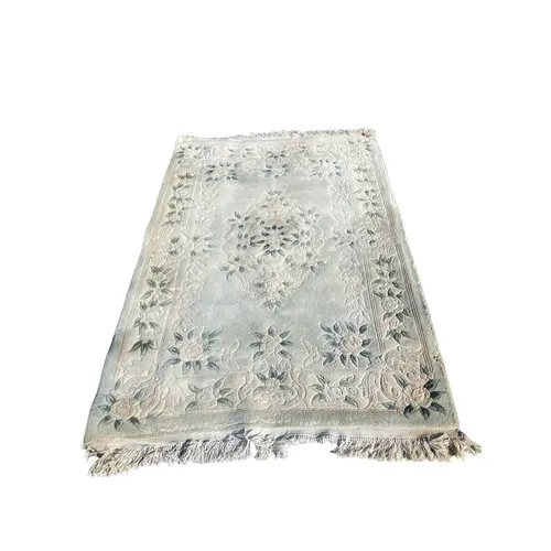 Hand-knotted Chinese Peking-style wool rug featuring soft fl...