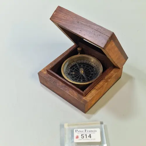 Vintage style brass pocket or marching compass in a small wo...