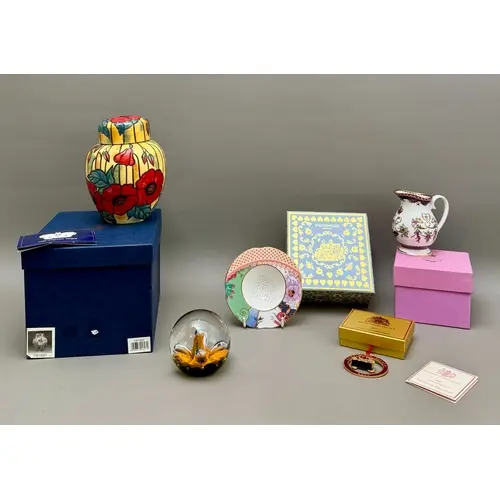 A small group of collectible china - comprising a Royal Doul...