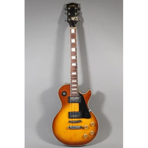 Satellite electric guitar with natural and black finish.