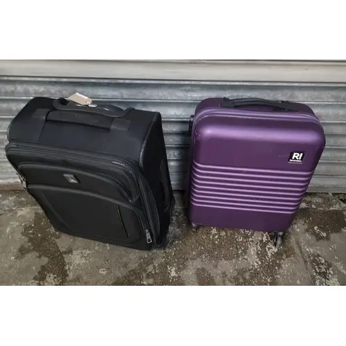 TWO SUITCASES INC. REVELATION, TRAVELPRO (ONE WHEEL MISSING)...