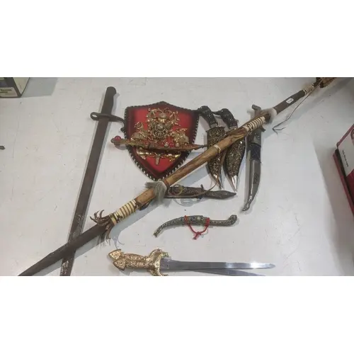 A collection of daggers to include a vintage military bayone...
