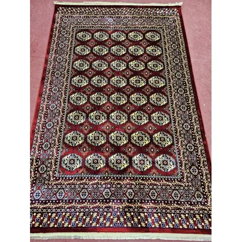 A red ground Turkish Soft Full Pile Carpet with central repe...