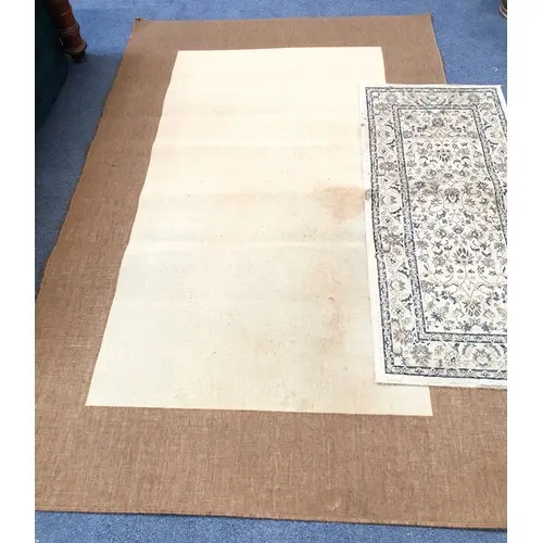 TWO FLOOR RUGS the smaller runner style example in shades of...