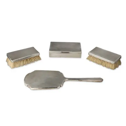 A PAIR OF ART DECO SILVER ENGINE TURNED MILITARY HAIR BRUSHE...