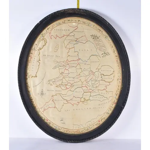 An antique framed embroidered silk map of England and Wales...