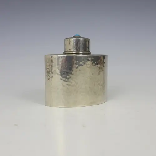 An Arts and Crafts pewter tea caddy, probably Archibald Knox...