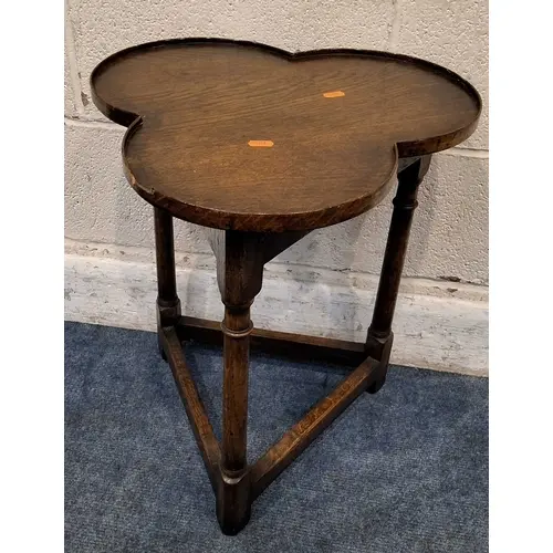 A GOOD QUALITY REPRODUCTION OAK TREFOIL / CLOVER TABLE, with...