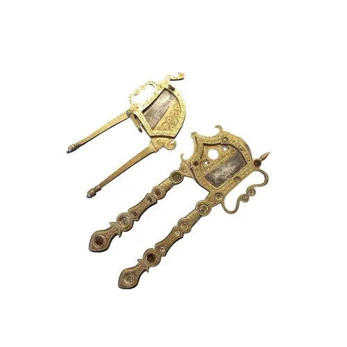 Two early 20th century brass betel cutters. Each featuring e...