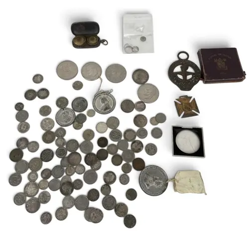 A COLLECTION OF SILVER COLOURED COINS AND MEDALS