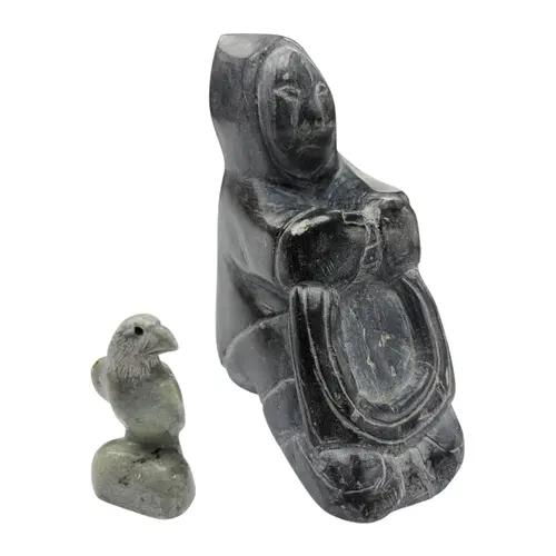 Two Inuit stone carvings of a seated figure and a falcon, la...