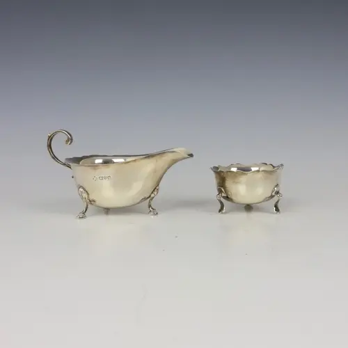 A George V silver sauce boat, Chester 1928, the shaped rim a...