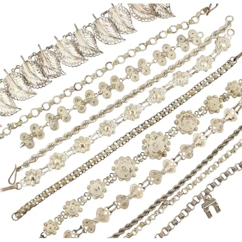 Collection of contemporary silver and white metal filigree b...