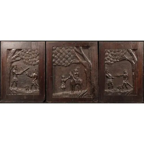 A 19th century garniture of three oak panels carved with Col...