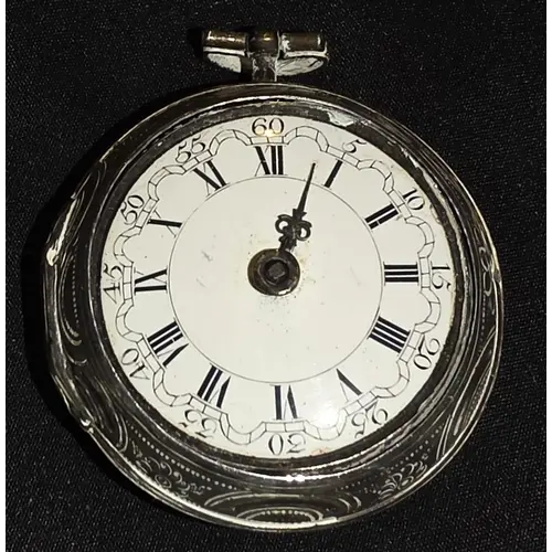 A 19th century pocket watch with embossed white metal case
