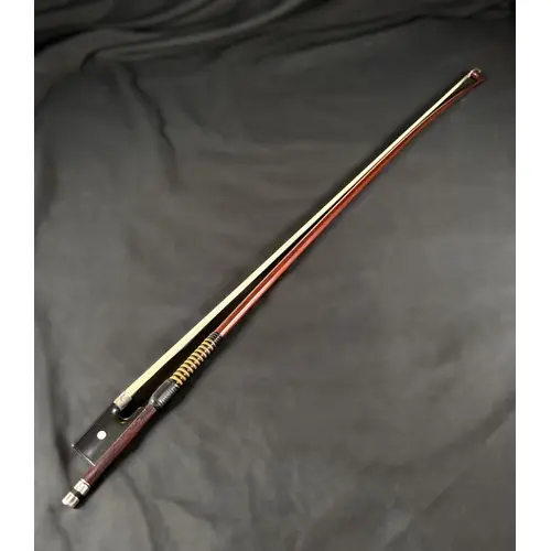 A late 19th/early 20th century violin bow with silver mounts...