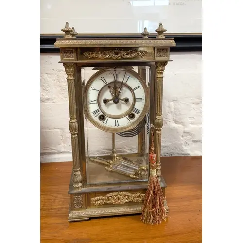 A Victorian striking mantel clock in glass and brass case, f...