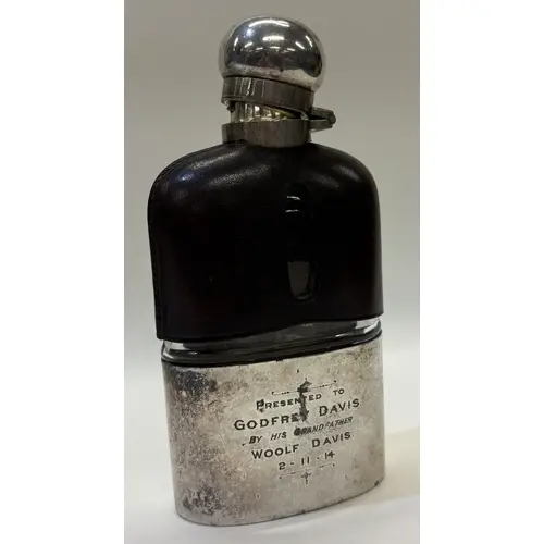 A 19th Century silver-mounted drinking flask. Est. £30 - £40...