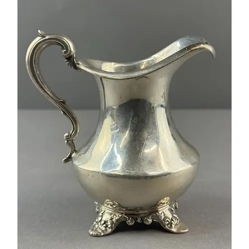 Silver: a cream jug by William Smily, London 1842, a flared ...