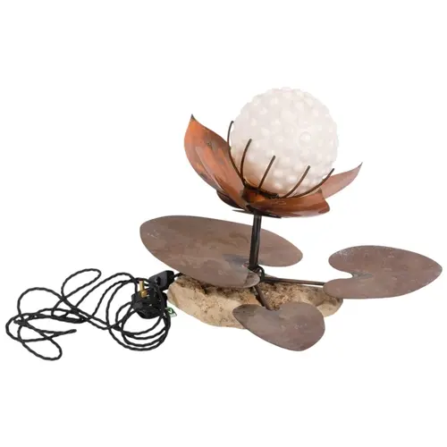 A brass Lilypad desk lamp on stone base, modelled as a water...