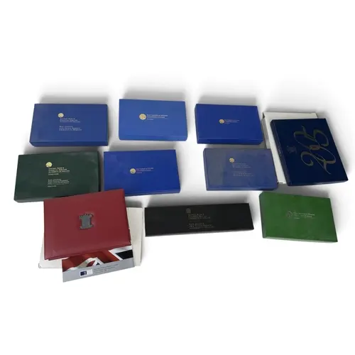 A COLLECTION OF BOXED IRISH AND BRITISH PROOF COIN SETS...