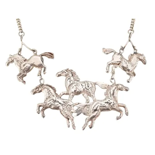 A 1980s hallmarked silver statement multi horse pendant neck...