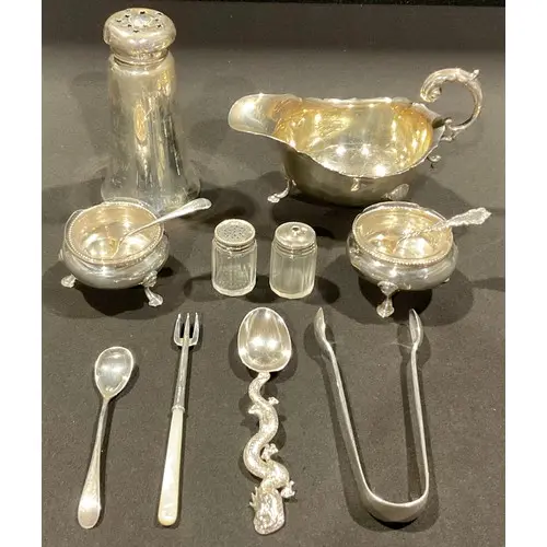 A George V silver sauce boat, 14cm long, Birmingham 1928; a ...