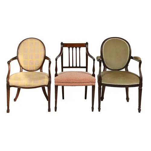 Two George III mahogany elbow chairs, with padded oval back,...