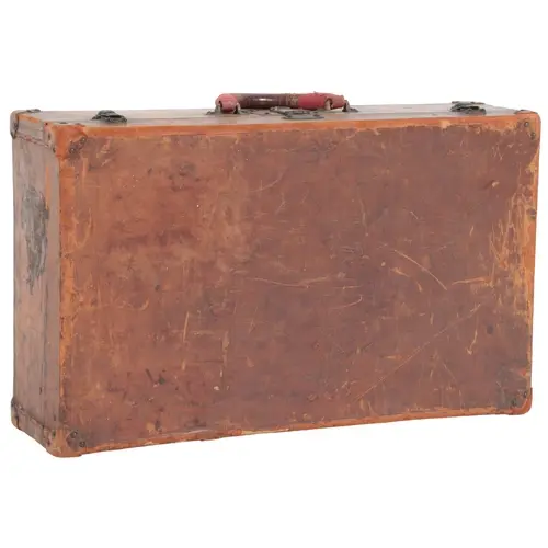 A Louis Vuitton tan leather suitcase, circa 1920s, hinged an...