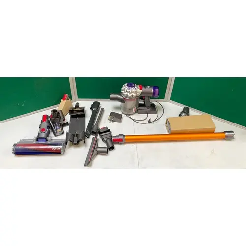 A Dyson V8 Absolute stick vacuum cleaner with charger, origi...