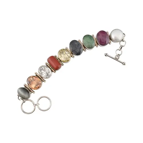 A silver nine stone bracelet. Silver link bracelet with t-ba...