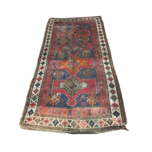An antique Turkish blue ground rug, 221 x 110cm