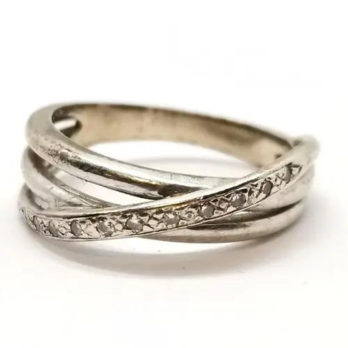 Unmarked white gold diamond set crossover ring - size L & 3g...