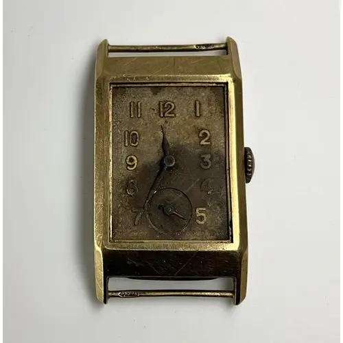 An Art Deco 9ct gold cased Rolex watch, unmarked dial, inner...