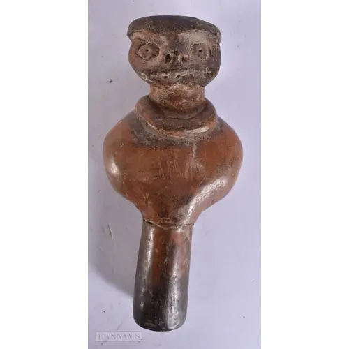 AN EARLY SOUTH AMERICAN CARVED HIGH FIRED POTTERY FIGURE. 12...
