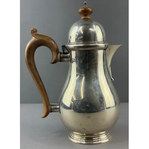 Silver: a coffee pot by Blackmore & Fletcher Ltd, London...