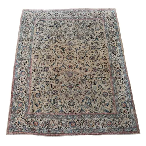 ORIENTAL CARPET OF KASHAN DESIGN. The ivory field with an al...