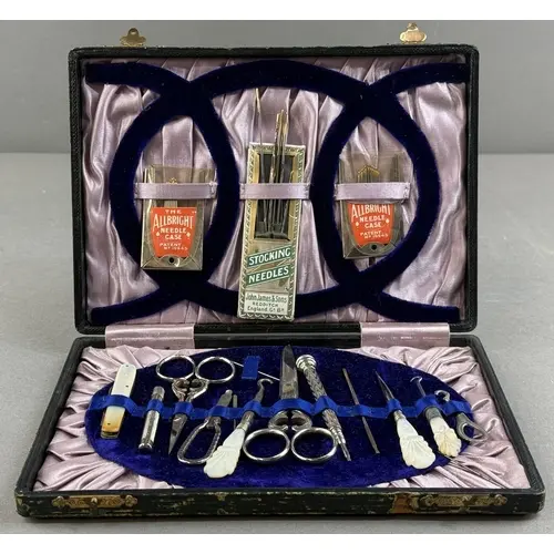 Decorative Arts: a cased mother of pearl handled sewing set,...